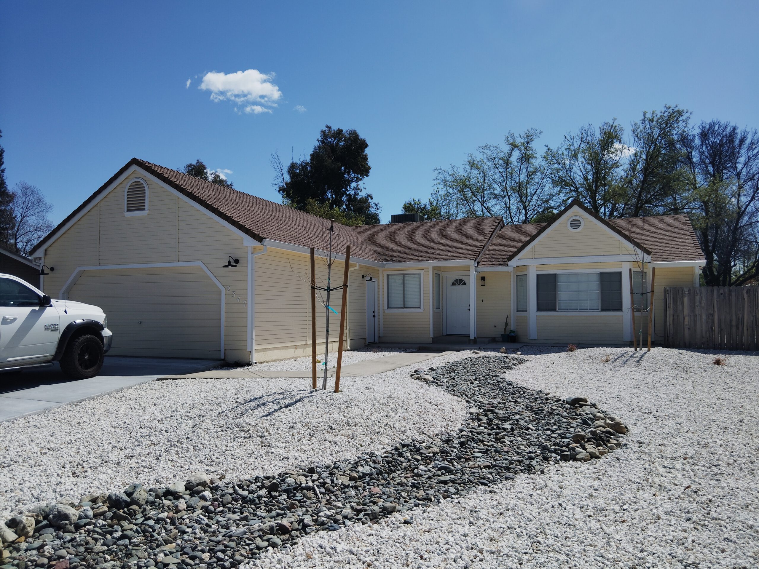 Before: exterior painting project on a home in Redding, CA — peeling and faded paint before Husky Pro Painting