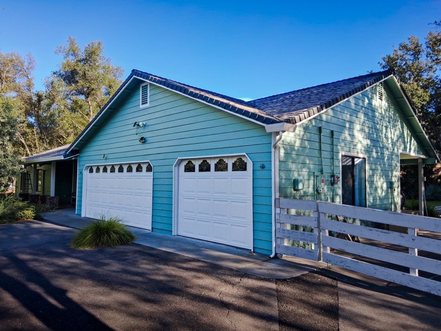 Teal aqua house exterior completed by Husky Pro Painting