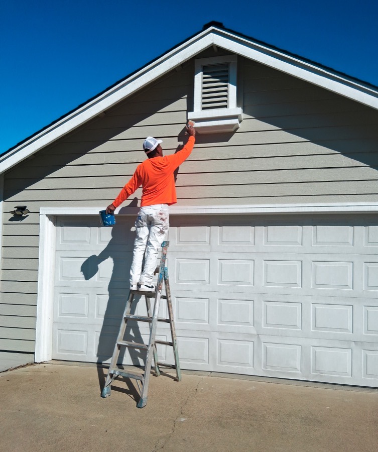 Husky Pro Painting crew painting house exterior in Redding CA