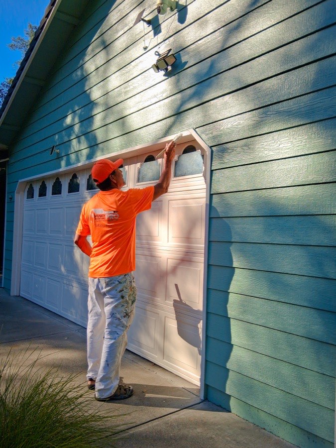 Husky Pro Painting professional painter at work on residential home, Shasta County